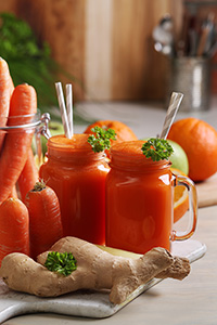 Carrot ginger juice in glass mugs